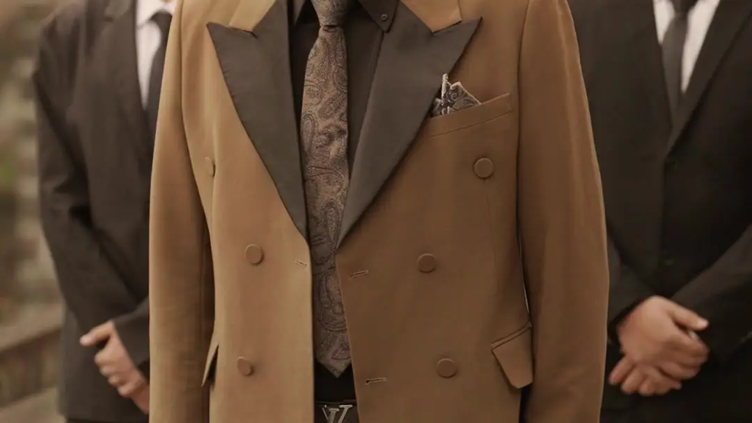 When Grief Wears a Belted Coat