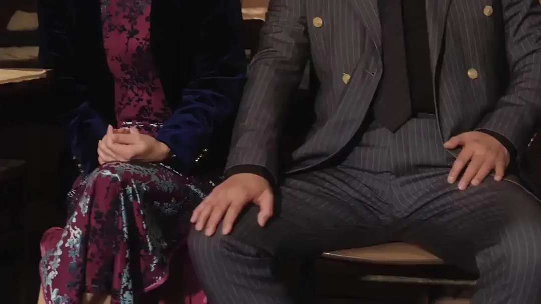 Apron vs. Suit: Power Play in a Dimly Lit Shop